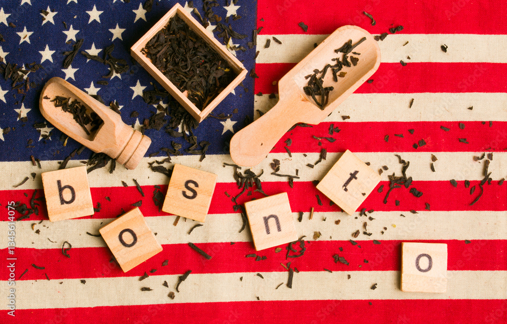 Fototapeta premium tea box on the usa flag with the word boston.Concept of the war for independence of the united states