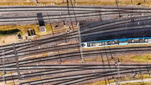 Railroad, train tracks and train aerial drone view from above, railway station in the Netherlands, transportation and public transport infrastructure concept