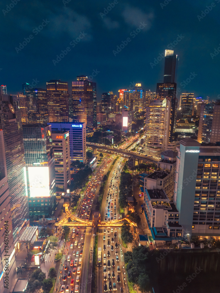 Fototapeta premium Night Cityscape with Busy Traffic and Illuminated Skyscrapers in Jakarta 