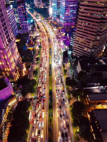 Night Cityscape with Busy Traffic and Illuminated Skyscrapers in Jakarta
