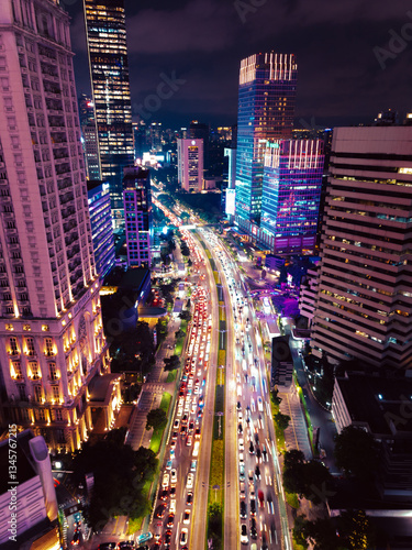 Night Cityscape with Busy Traffic and Illuminated Skyscrapers in Jakarta
