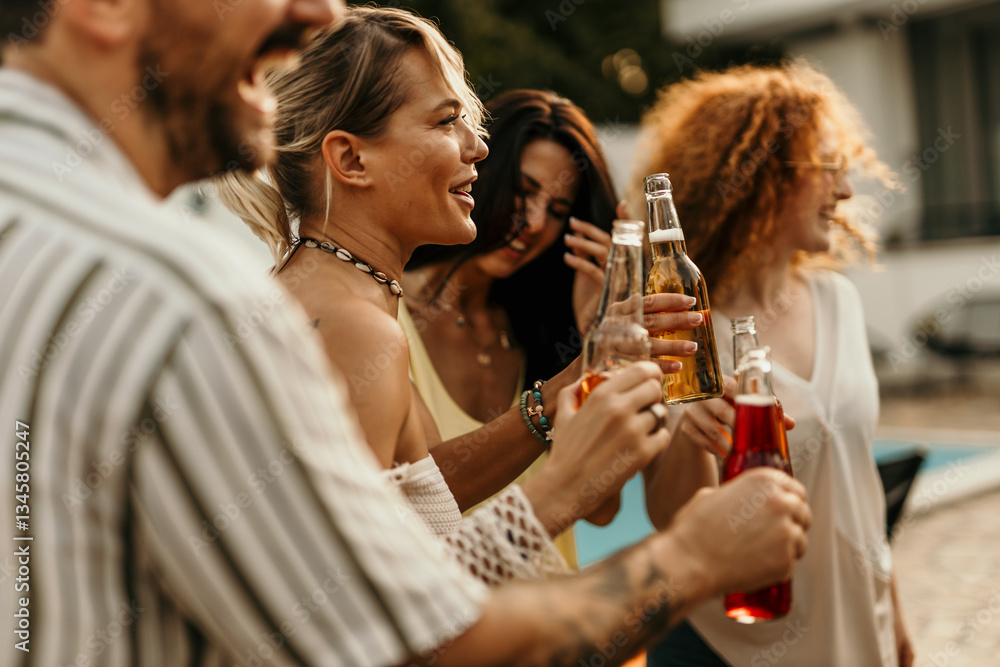 Friends enjoying drinks together at a pool party Friends enjoying drinks together at a pool party