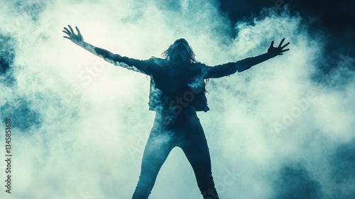 Wallpaper Mural A Silhouetted Person Stands Reaching Upward In Cloudy Atmosphere Torontodigital.ca