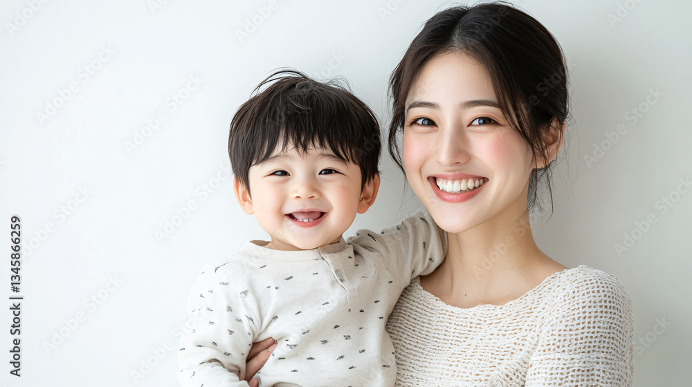 Studio Portrait of a Happy Asian Mother and Daughter: A Family Concept Featuring a Japanese Young Mother and Her Cute Son Interacting and Smiling in Front of a Plain White Background Studio Portrait of a Happy Asian Mother and Daughter: A Family Concept Featuring a Japanese Young Mother and Her Cute Son Interacting and Smiling in Front of a Plain White Background