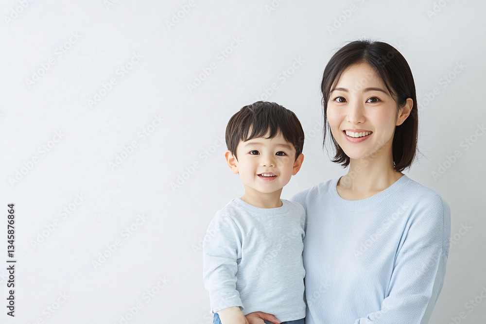 Studio Portrait of a Happy Asian Mother and Daughter: A Family Concept Featuring a Japanese Young Mother and Cute Son Interacting and Smiling in Front of a Plain White Background Studio Portrait of a Happy Asian Mother and Daughter: A Family Concept Featuring a Japanese Young Mother and Cute Son Interacting and Smiling in Front of a Plain White Background