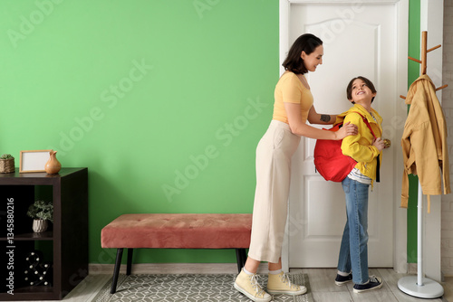 Mother getting her little s...