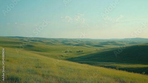 Gentle rolling hills covered in green grass under blue sky