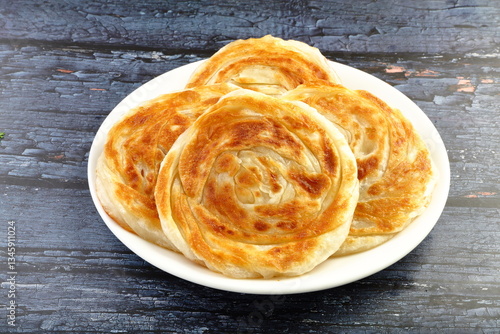 Kerala famous street foods- parotta, or porotta.