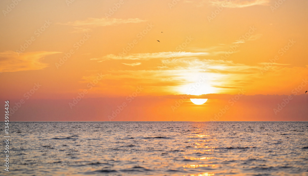 Naklejka premium Serene sunset over calm ocean horizon, tranquil reflection