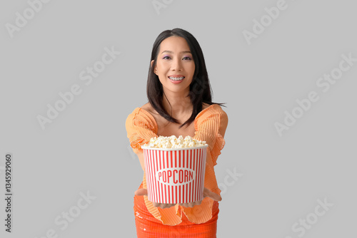 Young Asian woman with buck...