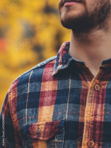 Close-up of a man wearing a plaid shirt, casual outfit