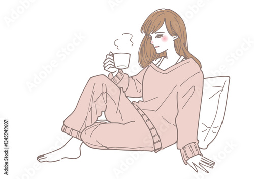 部屋で暖かい飲み物を飲みながらリラックスする女性