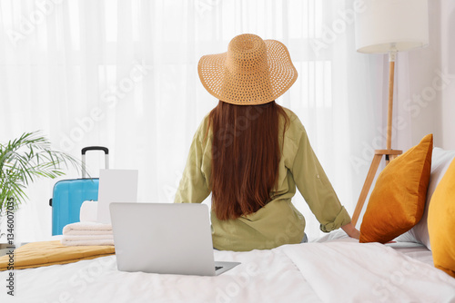 Female tourist with laptop ...