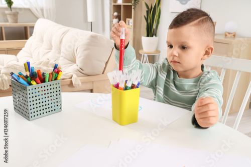 Funny little boy drawing wi...