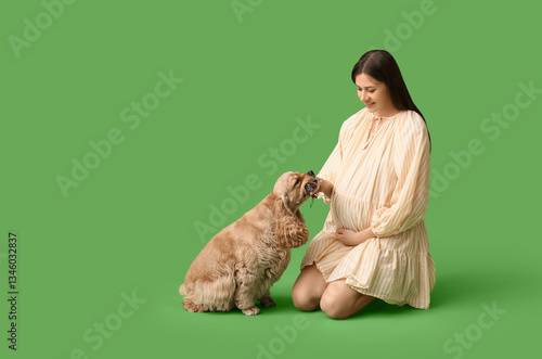 Pregnant woman kneeling wit...