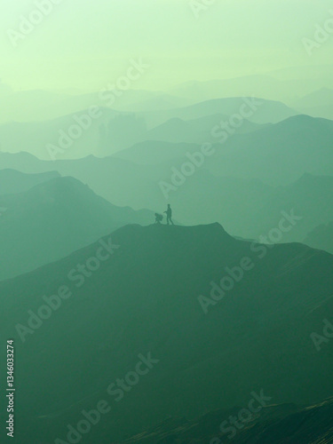 A view of sand dunes, layers and fog in bromo mountain during sunrise. This view can be seen from Bromo Mountain peak. 
