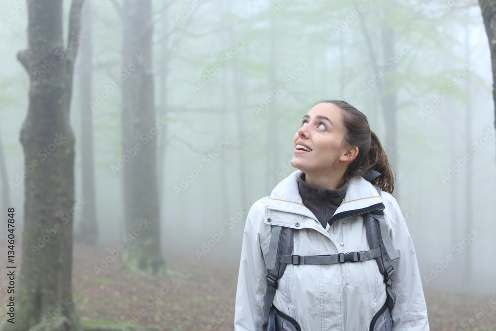 Happy trekker enjoying in the mountain looking at side Happy trekker enjoying in the mountain looking at side