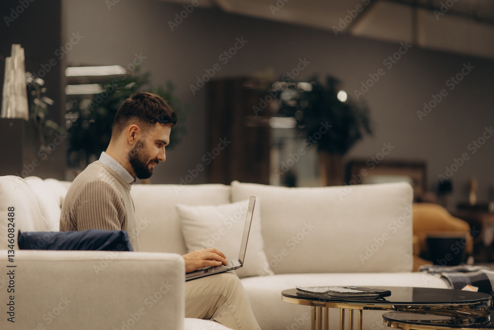 Man Working on Laptop in Modern Living Room Interior Man Working on Laptop in Modern Living Room Interior
