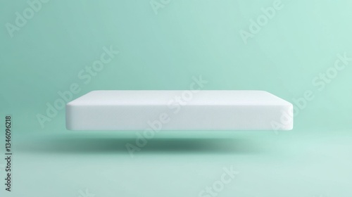 A premium white mattress floating above a smooth mint green background