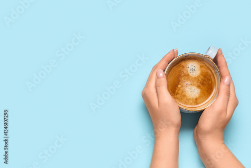 Female hands with cup of co...