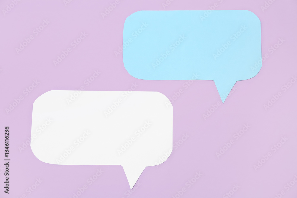 Blank paper speech bubbles on lilac background Blank paper speech bubbles on lilac background