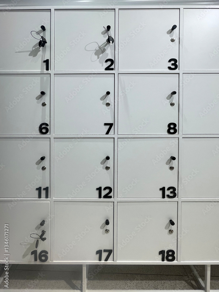 Changing locker on the pool. School lockers with open doors and sports equipment, items and accessories for sports.Interior of a indoor swimming pool changing and locker room Changing locker on the pool. School lockers with open doors and sports equipment, items and accessories for sports.Interior of a indoor swimming pool changing and locker room