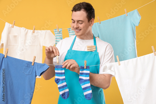 Handsome young man hanging ...