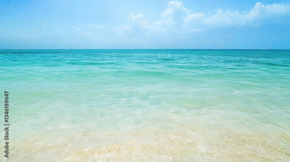 Tropical Ocean Paradise: Tranquil Turquoise Waters Meet Pristine Sandy Beach Under a Bright Blue Sky with Soft Clouds Tropical Ocean Paradise: Tranquil Turquoise Waters Meet Pristine Sandy Beach Under a Bright Blue Sky with Soft Clouds