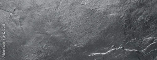 Gray slate stone background with a rough texture. The background features a natural, rugged gray appearance with subtle cracks. Textured stone background vector. Gray background.