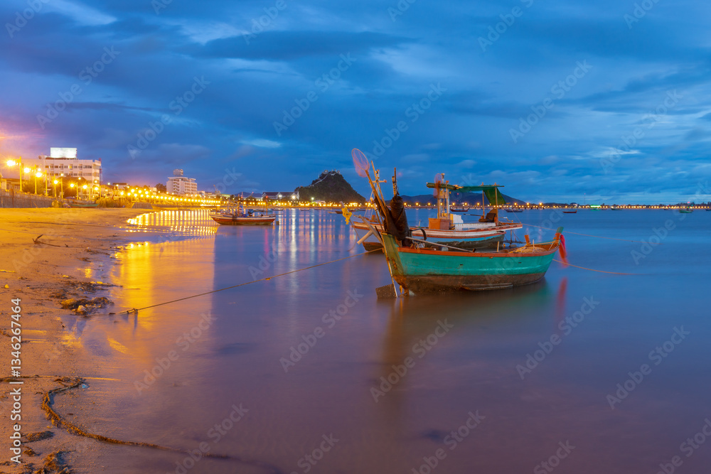 Fototapeta premium The beauty of sunrise and way of life of the fishermen of Ao Prachuap, one of the three famous bays located in Mueang District, Prachuap Khiri Khan