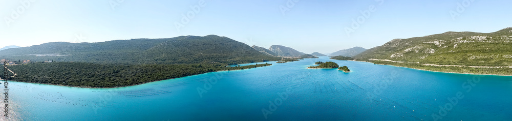 Aerial panoramic view of a Ston bay between continental Croatia and the Pelješac Peninsula in the Dalmatia Region Aerial panoramic view of a Ston bay between continental Croatia and the Pelješac Peninsula in the Dalmatia Region