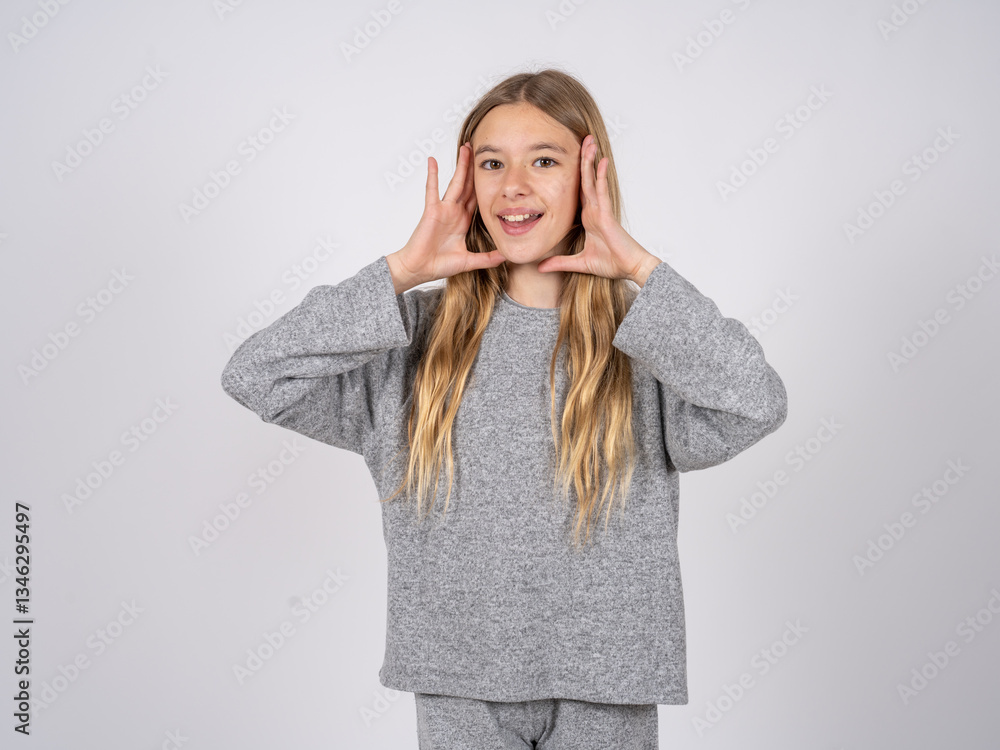 beautiful caucasian girl wearing grey track-suit Pleasant looking cheerful, Happy reaction beautiful caucasian girl wearing grey track-suit Pleasant looking cheerful, Happy reaction