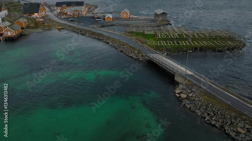 Wallpaper Mural Slow drone reveal shot of the famous yellow cabin with Olstind mountain in lofoten islands, Norway on a cloudy day Torontodigital.ca