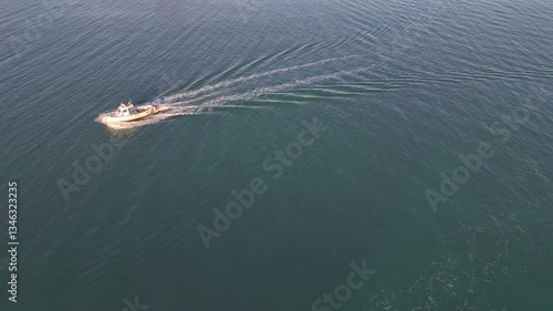 Aerial View of a Small Boat Cruising Through Calm Adriatic Waters