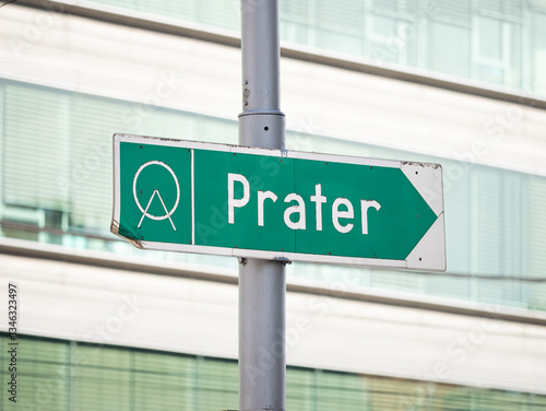 Prater sign to guide tourists to an amusement park in Vienna, Austria. Signpost with an arrow to the right. Famous tourist attraction in the city.