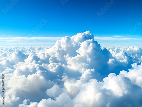 Beautiful blue sky above a sea of fluffy white clouds photo