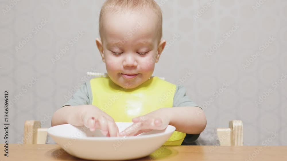 A charming and curious baby is interacting with food, showcasing exploration and joy during mealtime activities A charming and curious baby is interacting with food, showcasing exploration and joy during mealtime activities