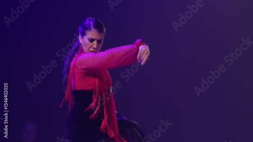 Close up of woman dancing flamenco on stage. Handheld