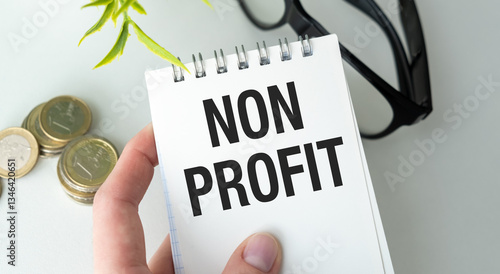 Canvas Print A person is holding a piece of paper that says Non Profit on it