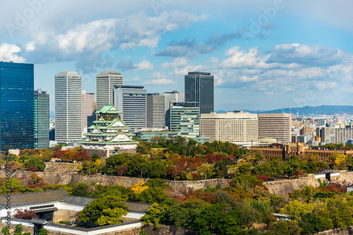 Osaka skyline with Osaka castle, landmark of Osaka city on clear blue sky background.