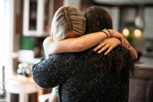 Fotografie Compassionate mother comforting depressed sad teen girl, hugging daughter with l
