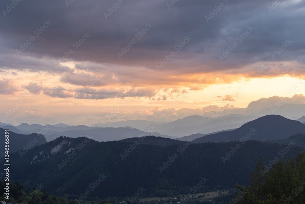 Layered mountains with cloudy sky at sunset. Landscape of the mountains Layered mountains with cloudy sky at sunset. Landscape of the mountains