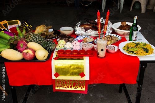 Sacrificial offerings food set for respect blessing to chinese deity folk religion of taoism god and memorial to ancestor in Chinese new year at house home on February 10, 2022 in Nonthaburi, Thailand