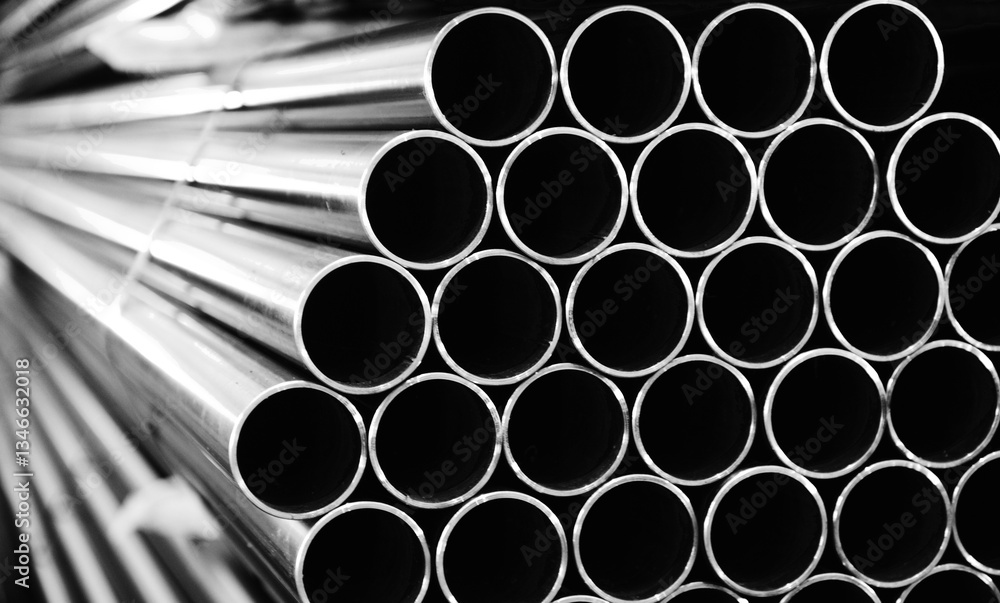 Metal steel tubes arranged in a warehouse, ready for industrial use. Metal steel tubes arranged in a warehouse, ready for industrial use.