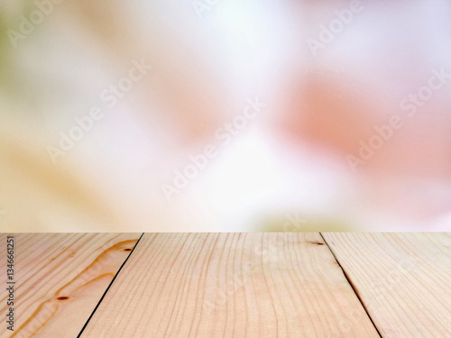Wooden board empty table top on of blurred background.