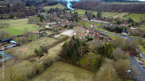 Aerial 4K Drone Footage of Hutton-le-Hole, North Yorkshire with Visible Fire in the Background