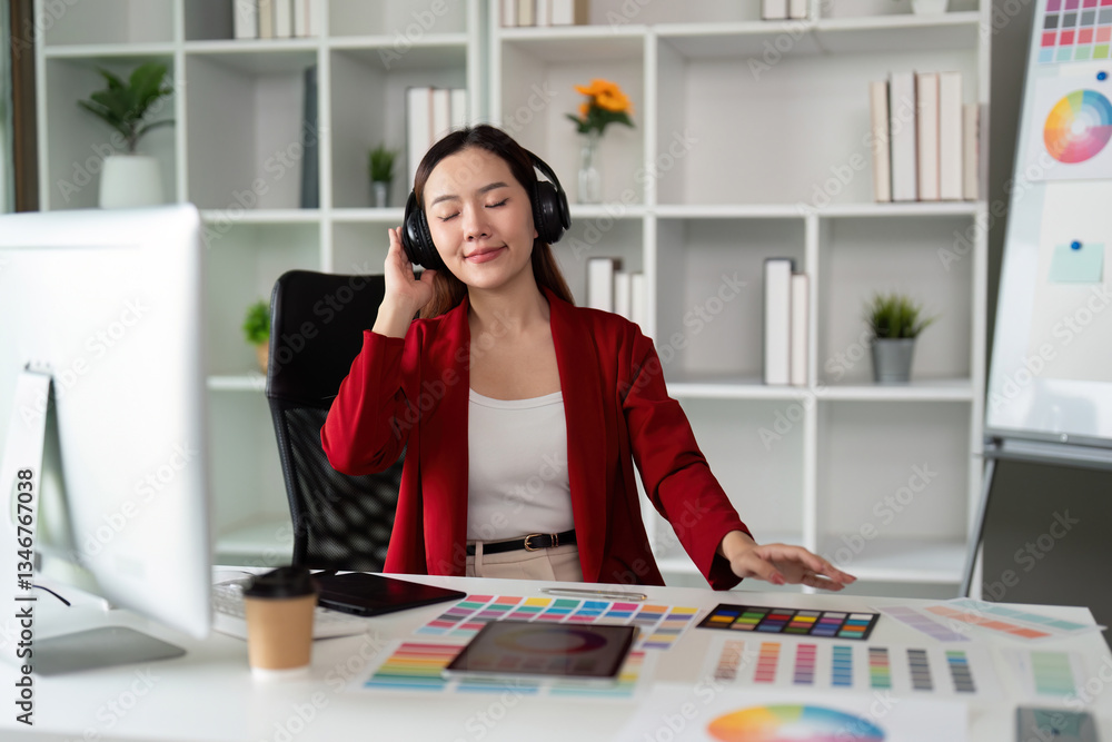 Focus and Music in Design. A graphic designer immersing herself in creativity with headphones. Focus and Music in Design. A graphic designer immersing herself in creativity with headphones.
