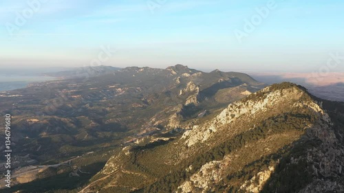 Sunlight illuminates Buffavento castle, nestled within the Kyrenia mountain range, showcasing the natural beauty of Cyprus