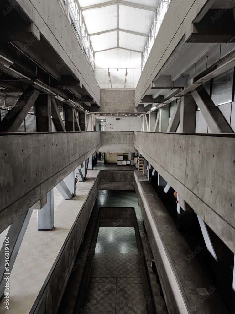 Fototapeta premium Empty and deserted high-rise building interior from above