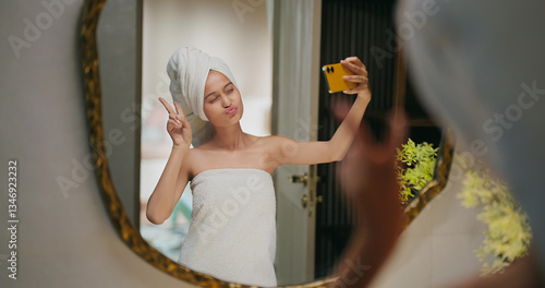 Canvas Print Indian happy gen z young adult female lady wrapped towel head and body after sho